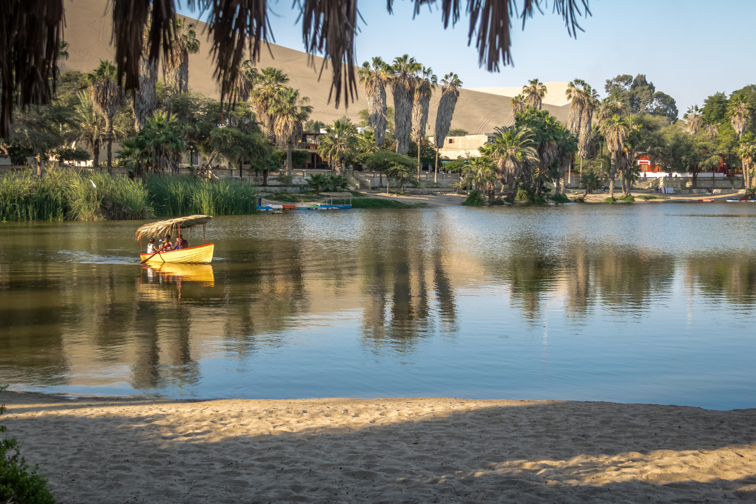 Small boat at Huacachina Oasis Lake - Ica, Peru