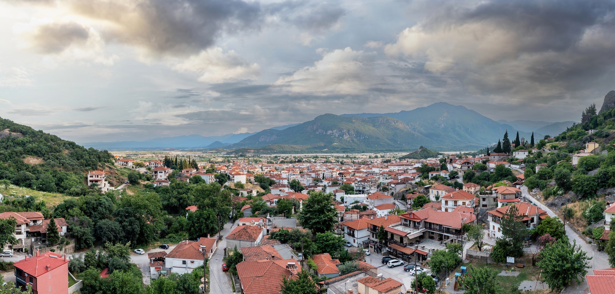 Kalambaka Greece. Sky with heavy clouds over Kalabaka town buildings and valley. Aerial view